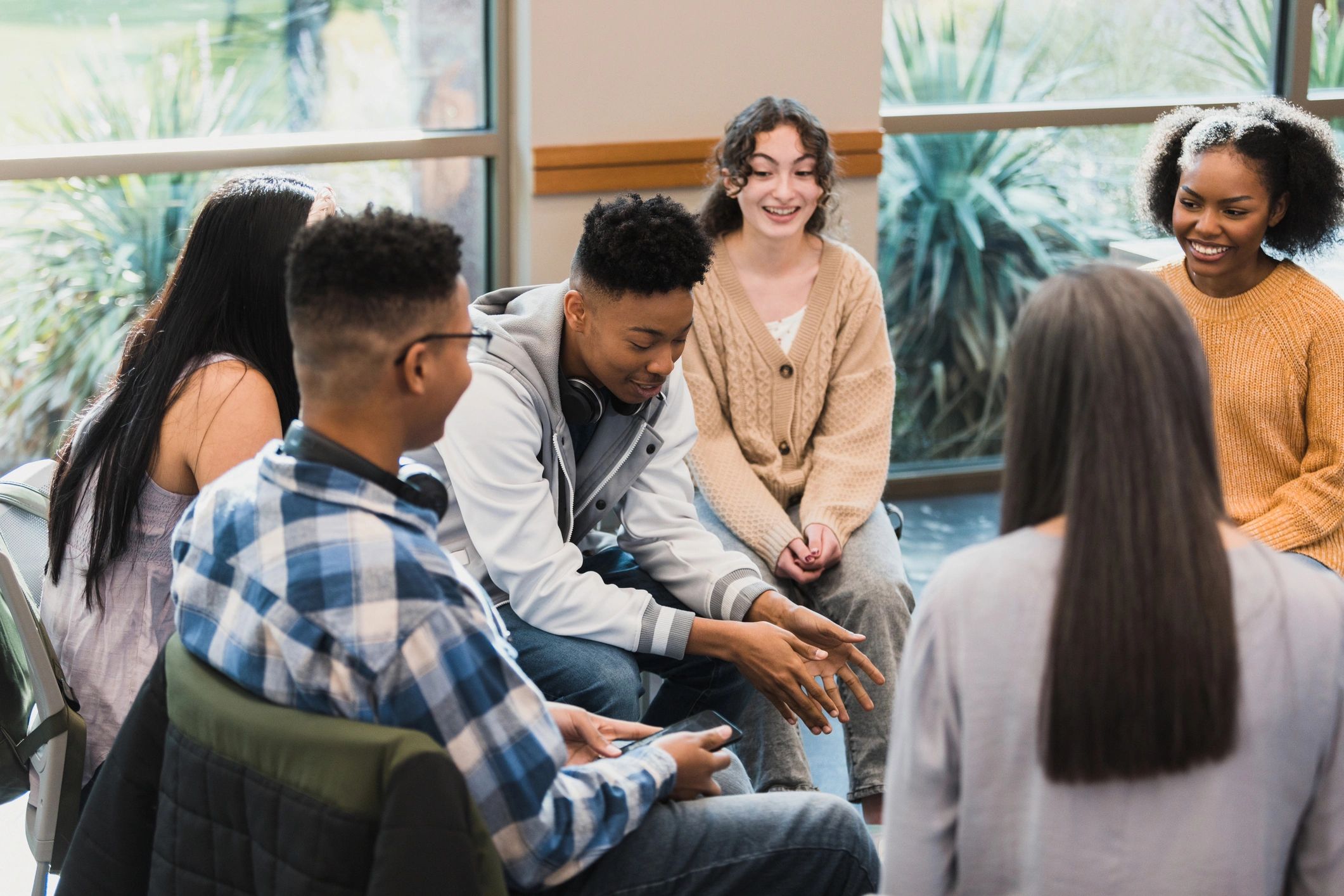 Young man sharing his story in a supportive group